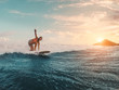 Fit female athlete surfing at sunset - Surfer woman performing outdoor inside ocean - Extreme sport, travel, healthy lifestyle, adventure and vacation concept - Focus on her body