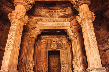 Ceiling and stone altar inside sacred Hindu temple in Khajuraho, India. Ancient columns in 10th century indian temple