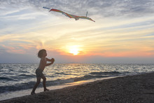 Little Boy Playing With Kite On Tropical Beach. Summer Vacation Concept, Child Playing On Sandy Beach