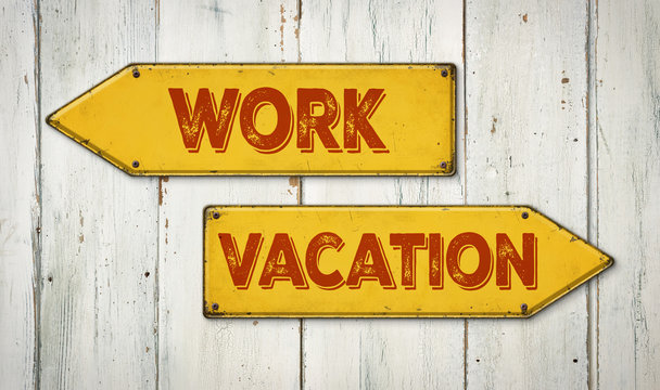 Direction signs on a wooden wall - Work or Vacation