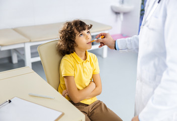 Boy taking temperature in hospital stock photo