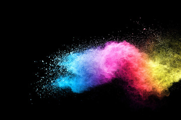 Wall Mural - explosion of colored powder isolated on black background. abstract colored background. holi festival