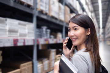 Wall Mural - Asian woman in Home center Warehouse to buy a retail furniture and home accessories store