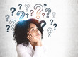 © ImageFlow - Young African woman and question marks