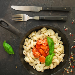 pasta with tomato sauce and sausages (Cavatappi, Elbow, Campanelle) serving second course. top food background. copy space