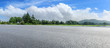 © ABCDstock - Country asphalt road and green woods nature landscape in summer