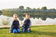 © satura_ - Children, childhood, people concept - Kids boys playing on a beach near river