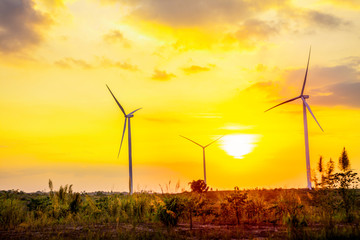 Wall Mural - landscape mountain view with windmills on the hill with sunset sky, wind turbine generator to build 