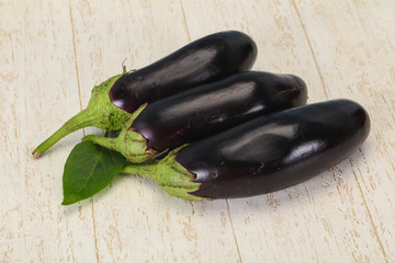 Ripe tasty Eggplant over wooden background