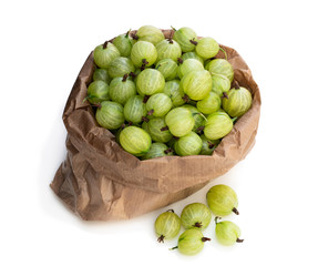 Paper bag full of gooseberries isolated on white