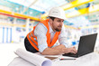 © industrieblick - engineer at his workplace with notebook in an industrial company in mechanical engineering