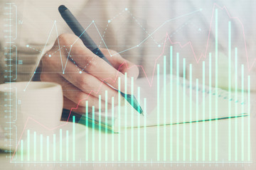 Forex chart displayed on woman's hand taking notes background. Concept of research. Double exposure