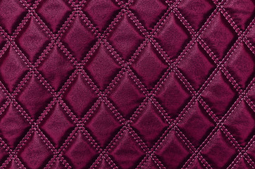   Red leather texture with stitched rhombuses