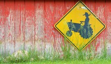 Tractor Crossing Sign On Old Wood Texture