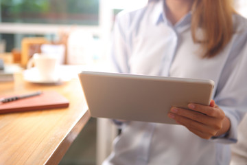 Business woman using tablet  in office