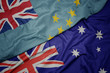 waving colorful flag of australia and national flag of Tuvalu.