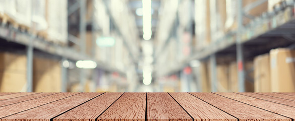 abstract blur background of inside corridor industry cargo with brown wood table perspective for show ,promote and advertisement design background concept