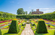 © IRStone - London, UK. West London Bushy park. Beautiful english garden view, with lots of trees and flowers. The Banqueting house at the background