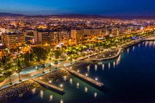 Republic Of Cyprus. Night View Of Limassol. Lit At Night The Streets Of Limassol. Top View Of Cyprus. Holidays In Cyprus. Piers And Quay. A Pedestrian Pier Leads To The Sea.