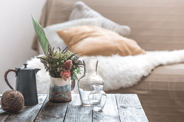 Wall Mural - Home interior with decorative items on a wooden table.