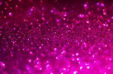 Defocused Abstract Background In Magenta Color. Glitter Bokeh Background. Decorative Christmas And New Year Party Background. Festive Backdrop For Your Projects
