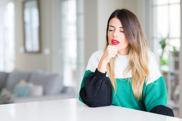 Canvas Print - Young beautiful woman wearing winter sweater at home feeling unwell and coughing as symptom for cold or bronchitis. Healthcare concept.