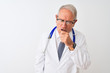 © Krakenimages.com - Senior grey-haired doctor man wearing stethoscope standing over isolated white background feeling unwell and coughing as symptom for cold or bronchitis. Healthcare concept.