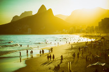 Scenic Sunset View Of Ipanema Beach On A Busy Summer Afternoon In Rio De Janeiro, Brazil