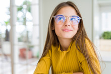 Beautiful Young Girl Kid Wearing Glasses Smiling Looking Side And Staring Away Thinking.