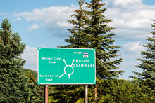 Aspen, USA Town In Colorado With Roundabout Road Sign For Castle And Maroon Creek And Basalt Snowmass
