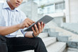 © DragonImages - Hands of business executive pointing at digital tablet when checking e-mails from clients and colleagues