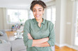 © Krakenimages.com - Beautiful young african american woman smiling friendly with crossed arms looking at the camera with big smile
