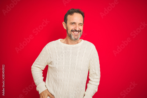 Handsome Middle Age Senior Man With Grey Hair Over Isolated Red