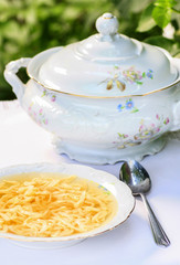 Wall Mural - Traditional broth (chicken soup) with noodles.