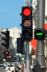 Images of red traffic lights and people..People are moving across the street and red traffic light.