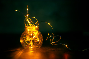 Wall Mural - garland in a bottle, christmas wallpaper concept. the warmth and comfort of home