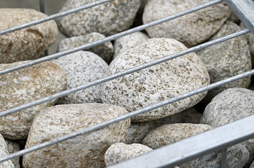 Poster - Decorative stones stored in the frame for a low wall.