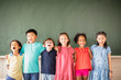 © Tom Wang - Multi-ethnic group of school children standing in classroom