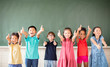 © Tom Wang - Multi-ethnic group of school children standing in classroom