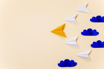 Leadership concept with origami paper planes and 3d clouds. Creative concept for banner/landing page/background.