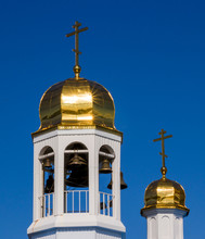 Two Golden Domes With Crosses On The Church Roof