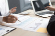 © Puwasit Inyavileart - Financial and investment planning, Head of Marketing is analyzing data from the summary graph statistics for executives, business meetings.