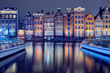 Old Brick Houses On The Canal In Amsterdam At Night