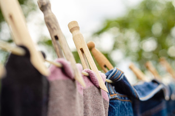 Wall Mural - Socks hanging on a clothes line in a garden to dry.