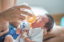 Newborn Infant Baby Boy Eat Milk Feed By Father