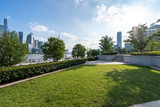 Fototapeta Londyn - green lawn with city skyline in shanghai china
