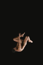 Gymnast Doing Somersault Exercise In Air