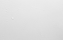 Water Drop On White Surface As Background