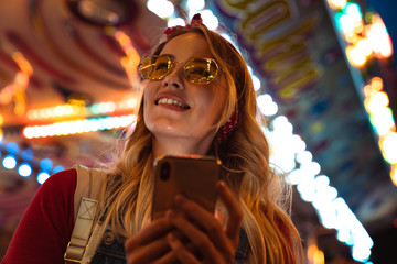 Poster - Close up of a cheerful young blonde woman spending time