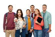 © Syda Productions - education, high school and people concept - group of smiling students with books and bags pointing at you over white background